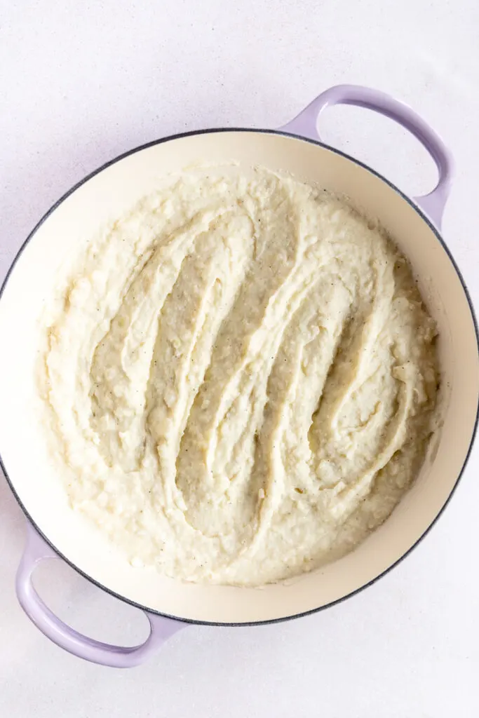 A lavender braiser filled with swirled horseradish mashed potatoes.