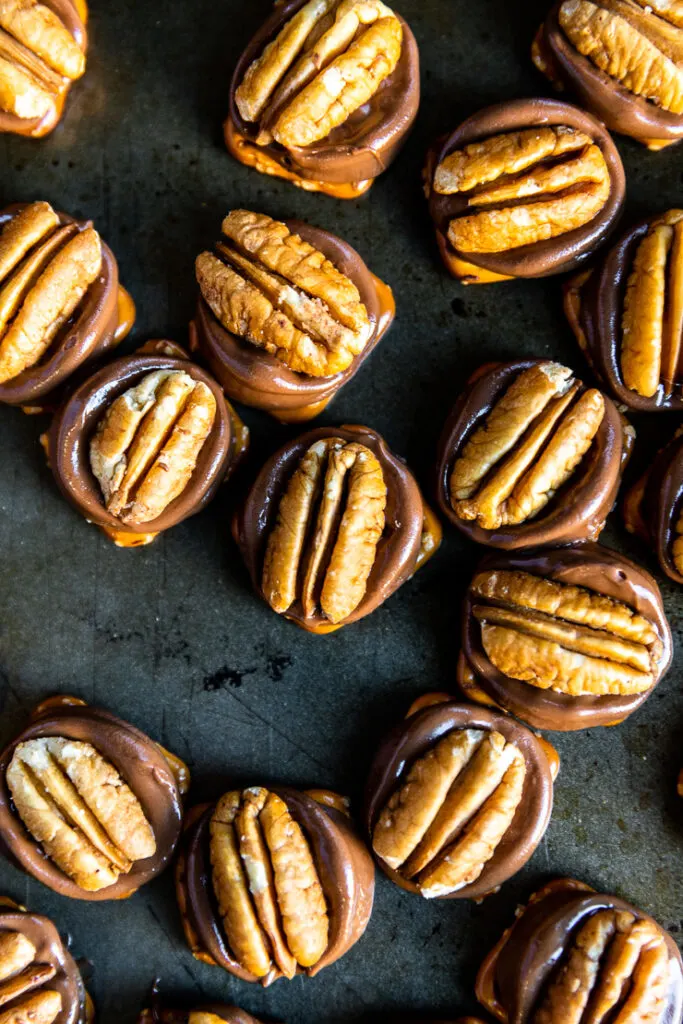 A close up of the Rolo pretzel turtles with glistening melted chocolate.