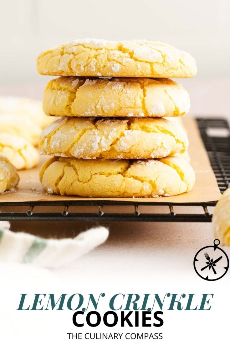 A stack of four powdered sugar-dusted lemon crinkle cookies sits on parchment paper on a cooling rack, with more cookies and a striped cloth partially visible nearby. Text at the bottom reads Lemon Crinkle Cookies.